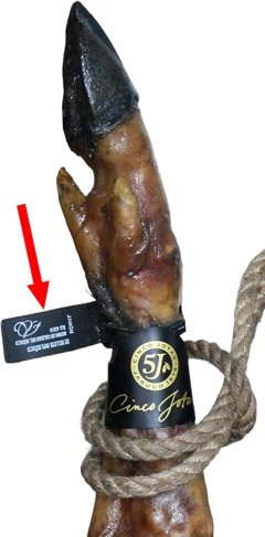 Black plastic seal around the hoof of an iberian ham
