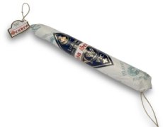 Salchichón in its original paper wrap